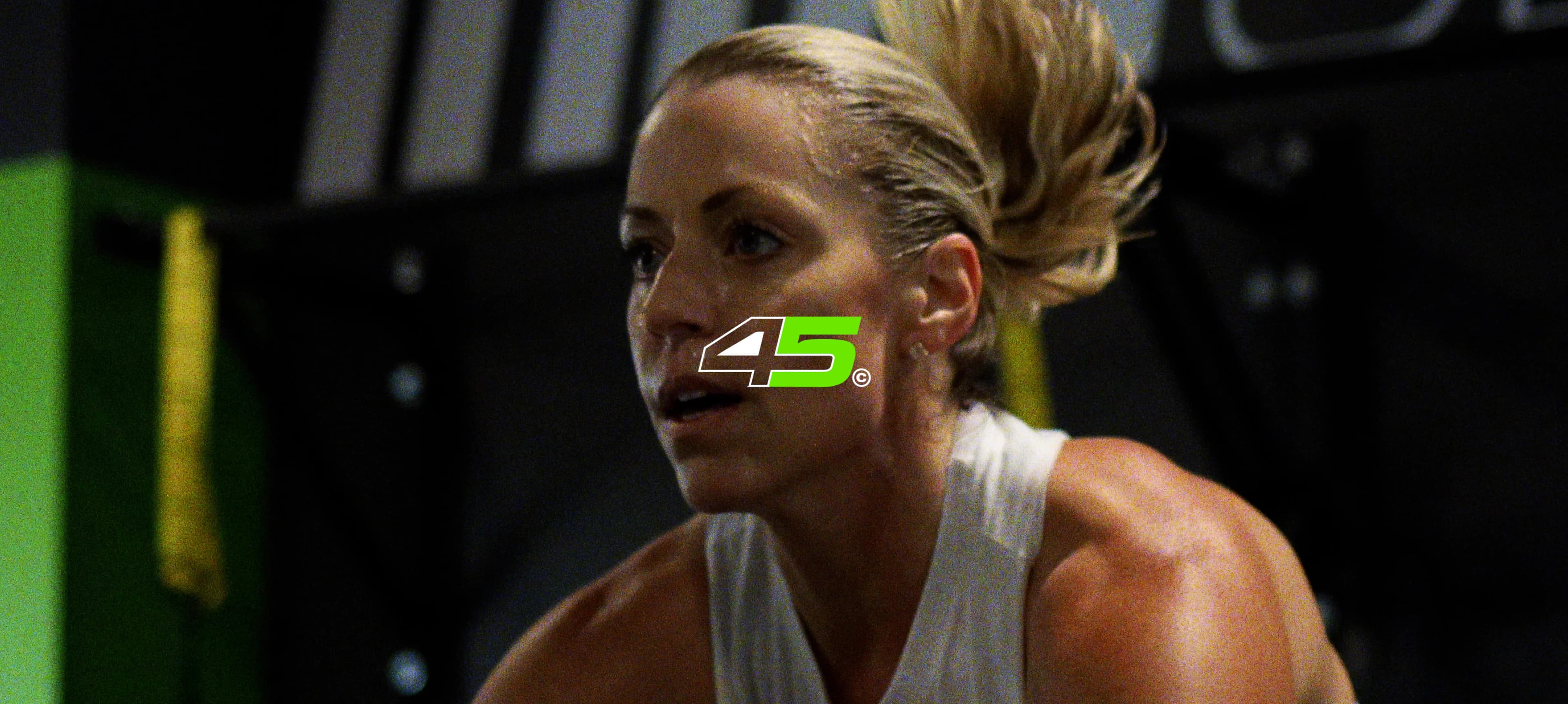 Female athlete portrait with a fluorescent green face mark