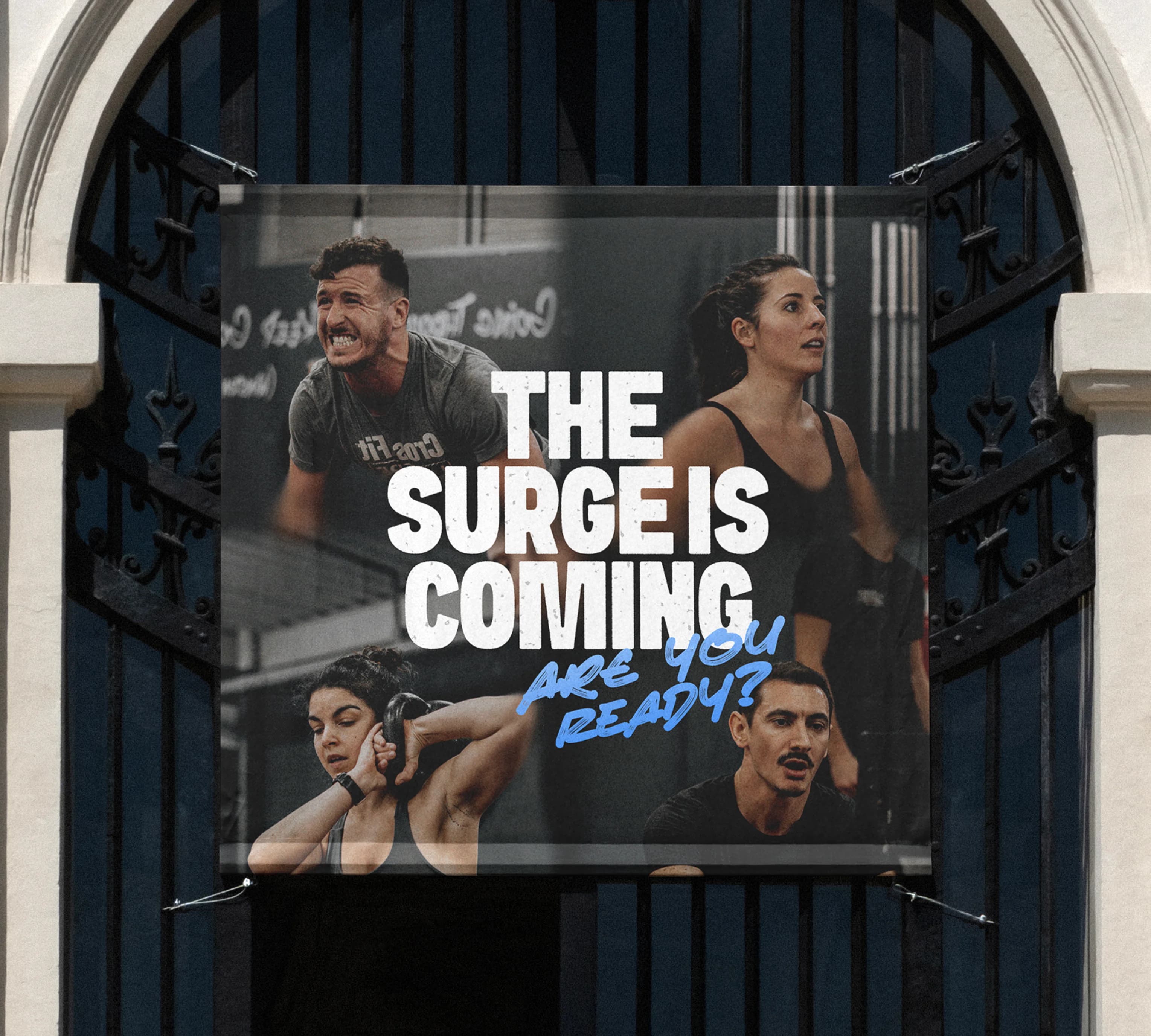 The Surge Is Coming campaign displayed on a building billboard